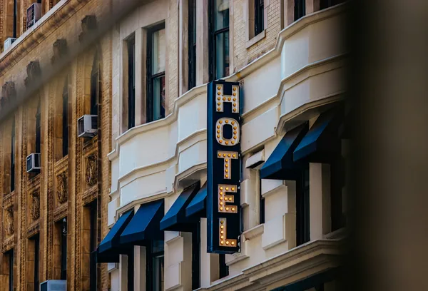Vintage theater marquee with illuminated letters on historic building facade